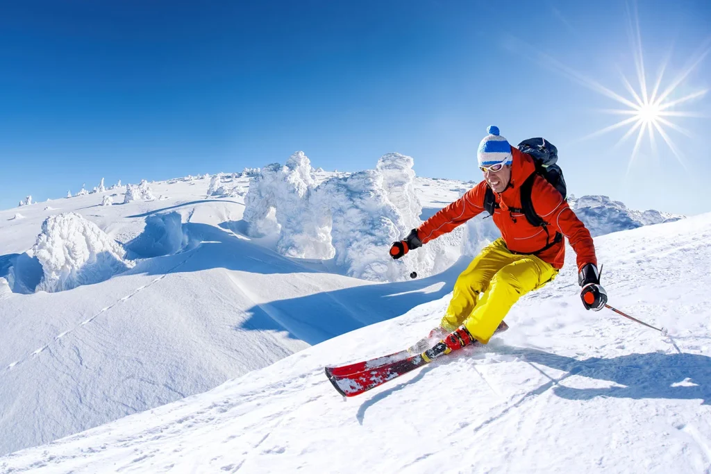 skier skiing downhill mountains img
